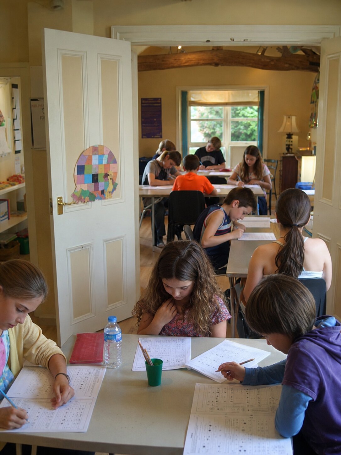 Students completing written work at desks in the tutorial centre